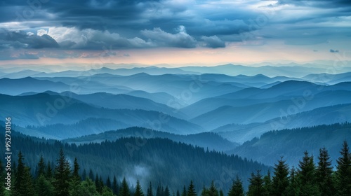 Layers of mountain ridges and forests beneath a moody sky