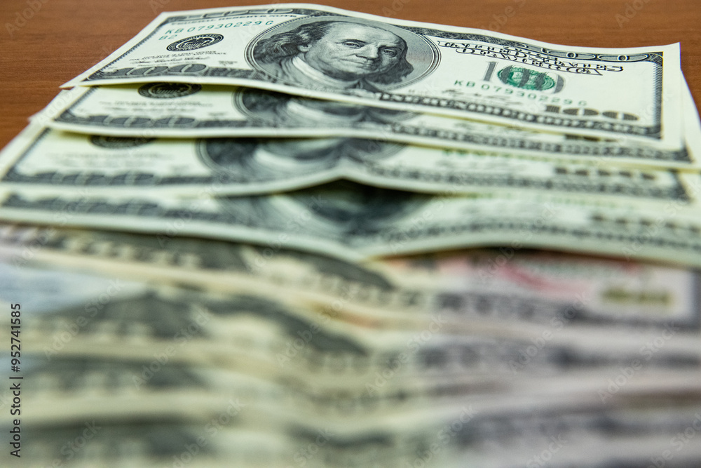 Thick wad of money cash on table Thick wad of money cash on table