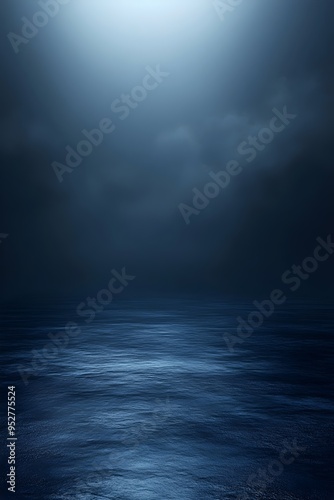 A calming, serene seascape at night with a single light source breaking through the dark clouds above the water.