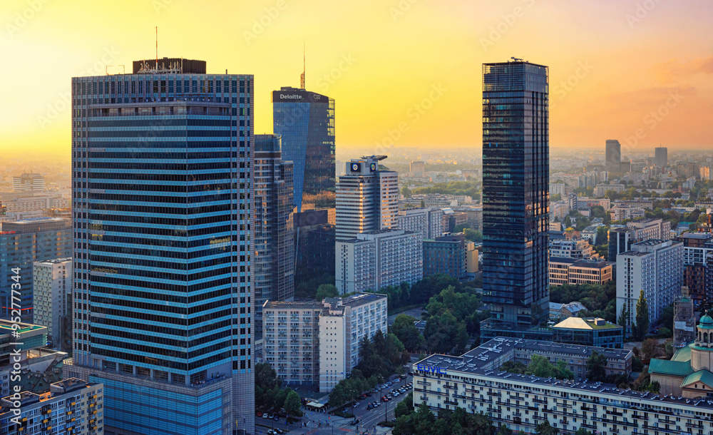 Cityscape at sunset - top view of the Downtown district of Warsaw with high-rise buildings, located within the Wola district in western Warsaw, Poland