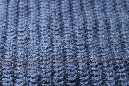 Texture of blue knitted fabric as background, closeup