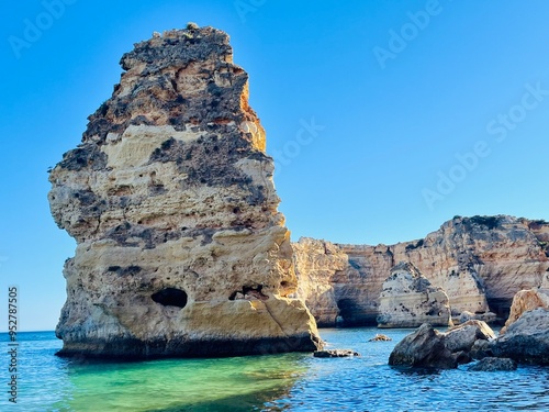 Oddly shaped jagged rock formations and cliffs at Lagoa Beach, Faro District, Southern Portugal.