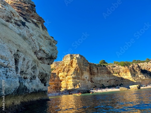 Oddly shaped jagged rock formations and cliffs at Lagoa Beach, Faro District, Southern Portugal.
