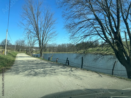 country road with lake