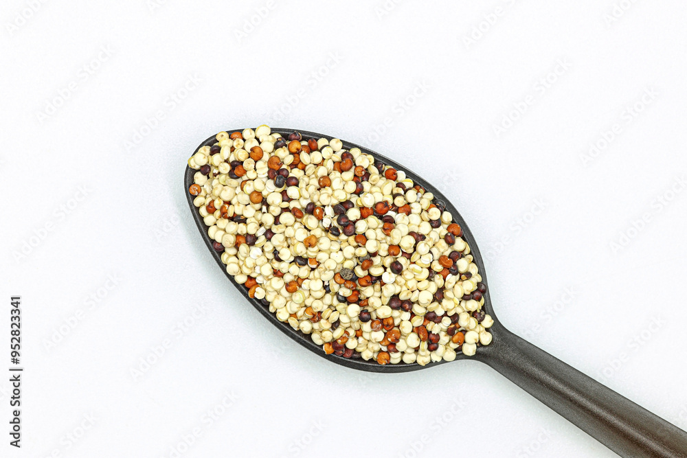 Healthy and nutritious food. Macro photograph of a teaspoon with quinoa grains Healthy and nutritious food. Macro photograph of a teaspoon with quinoa grains