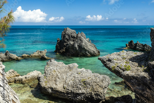 A picturesque scene of Tobacco Bay Bermuda with crystal-clear turquoise waters, reflecting the sunlight and enhancing the coastal allure photo