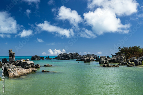 A picturesque scene of Tobacco Bay Bermuda with crystal-clear turquoise waters, reflecting the sunlight and enhancing the coastal allure