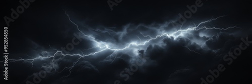 A bright flash of lightning splits through the dark clouds, illuminating the sky in an awe-inspiring display during a nighttime thunderstorm