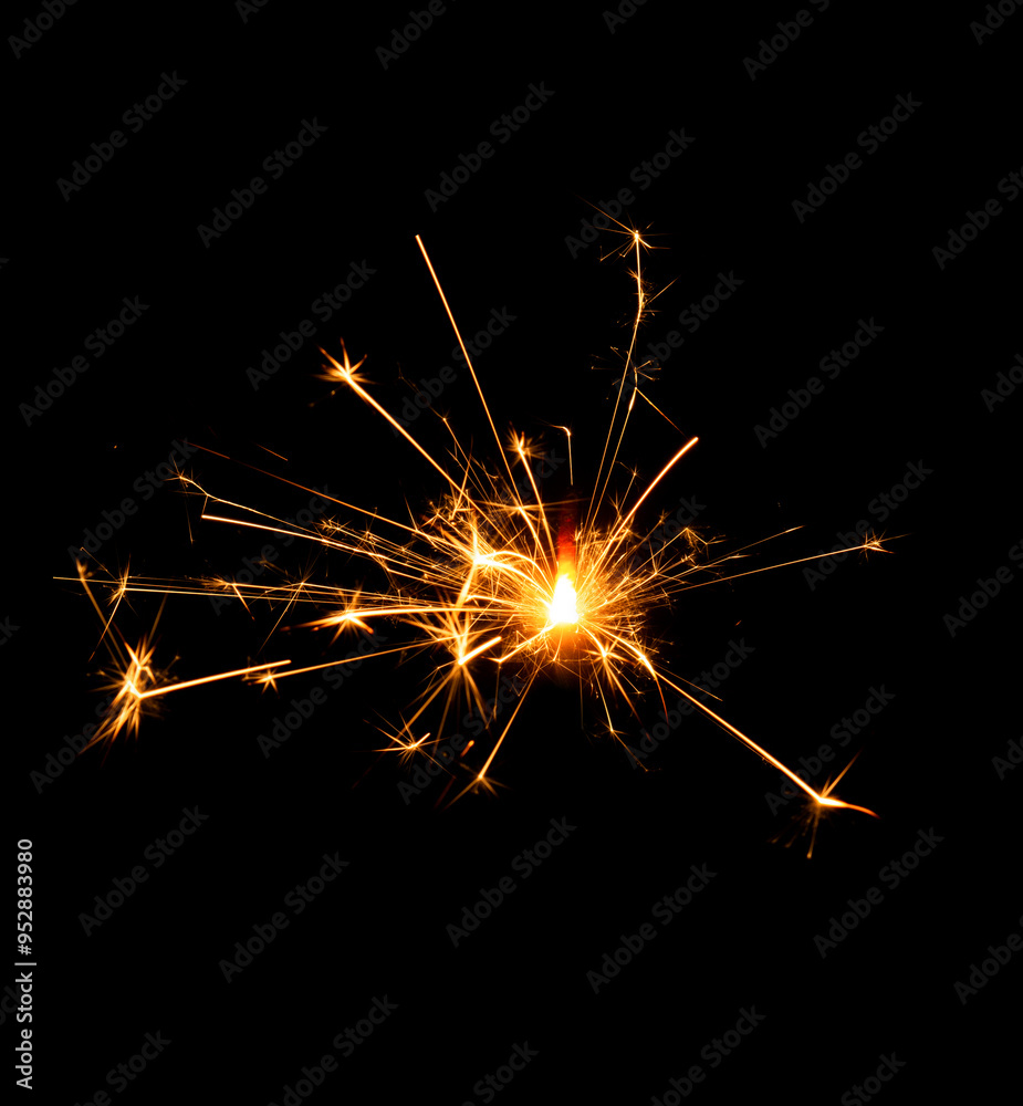 Christmas sparkler burning isolated on black background... Christmas sparkler burning isolated on black background...