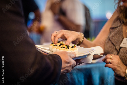 Εκτύπωση καμβά close up of a person holding a tray with appetizers