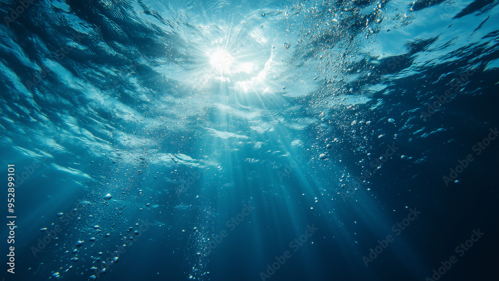 Sunlit Bubbles Beneath the Deep Blue Ocean Surface