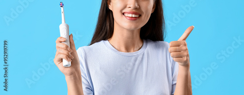 Smiling young Asian woman w...