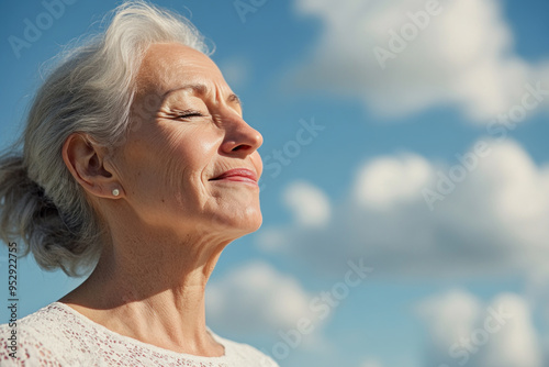 Germany senior woman taking a breath on a sunny day, mental health