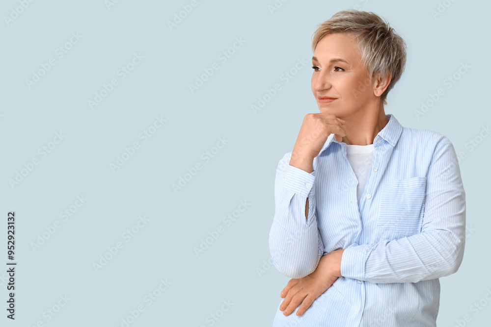 Beautiful mature woman on light background Beautiful mature woman on light background