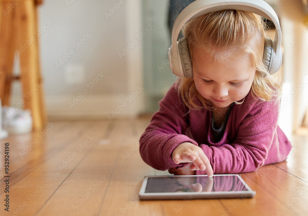 Child, tablet and digital game with web education, fun and youth development on home floor. Young girl, technology and school learning app with online video watching, toddler headphones and mockup Child, tablet and digital game with web education, fun and youth development on home floor. Young girl, technology and school learning app with online video watching, toddler headphones and mockup