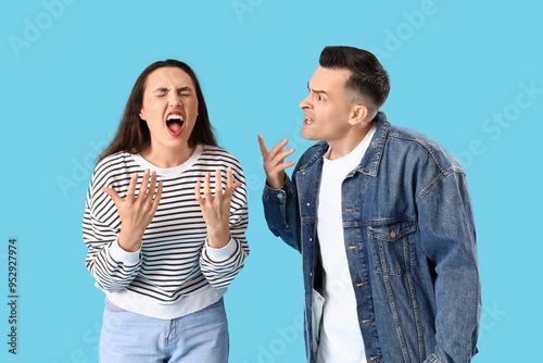 Angry young couple quarreli...
