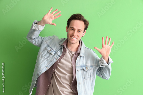 Young man showing hands on ...