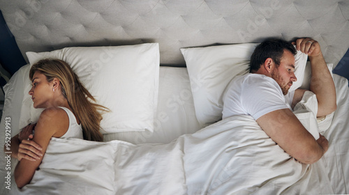 Frustrated couple, bed and above with argument for fight, conflict or cheating affair at home. Top view, man and woman with seperation for disagreement, toxic marriage or bad relationship in bedroom