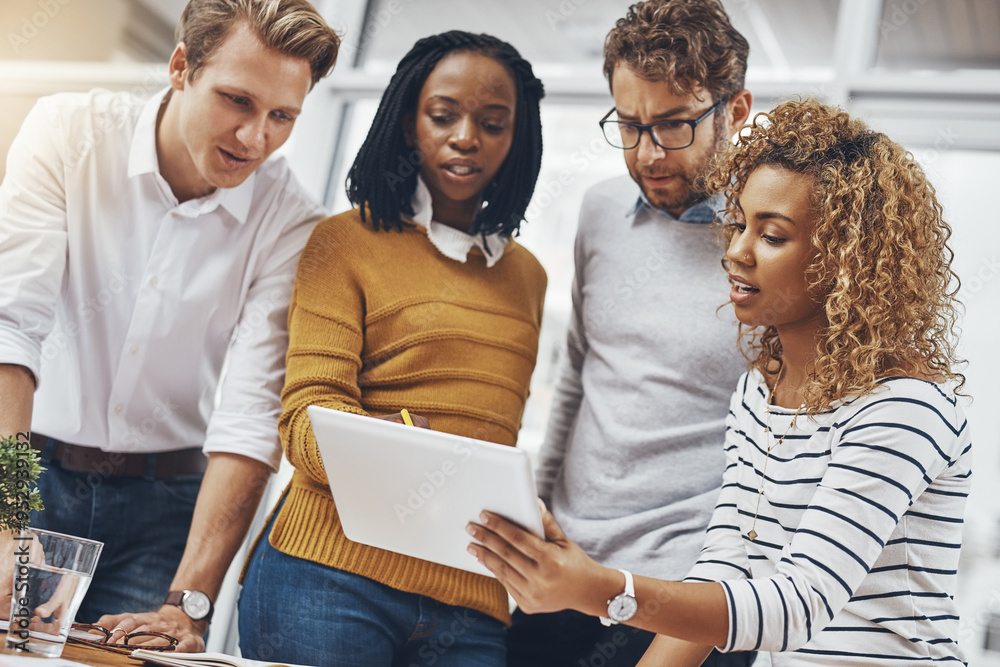 © BestCam/peopleimages.com - Tablet, team and creative business people planning, problem solving or brainstorming idea. Tech, group and discussion for project, research or solution with campaign manager in low angle at startup