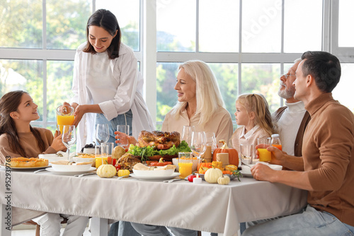 Happy family having dinner ...