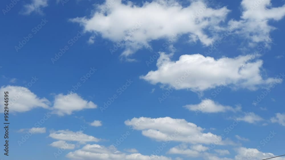 White clouds moving against a blue sky background, Hyperlape of rolling clouds White clouds moving against a blue sky background, Hyperlape of rolling clouds