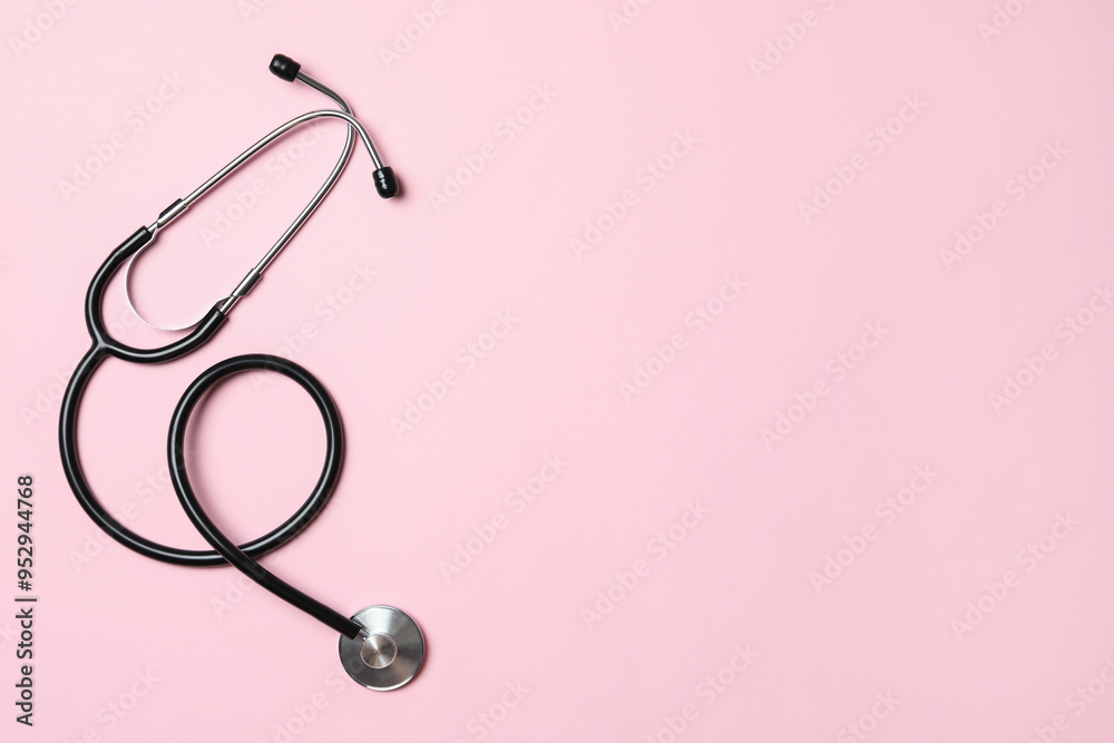 Stethoscope on pink background, top view. Space for text Stethoscope on pink background, top view. Space for text