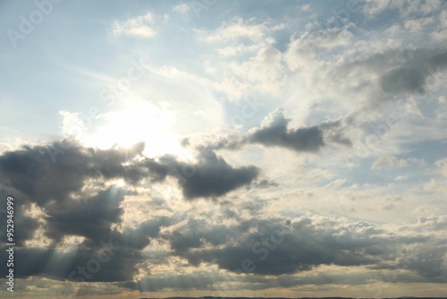 Sun shining through clouds on beautiful sky