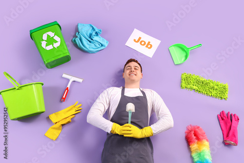 Male janitor with cleaning ...