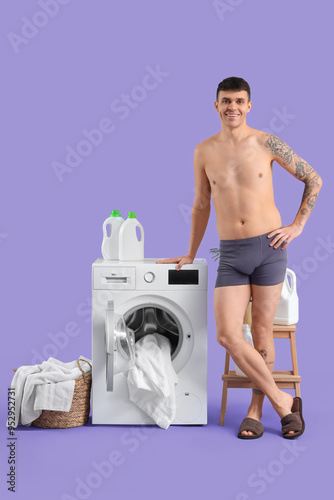Young man in underpants doi...