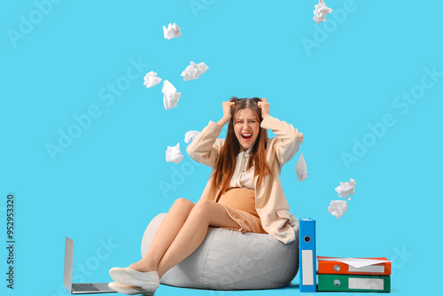 Stressed pregnant businessw...