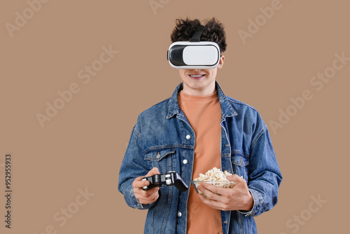Young man in VR glasses wit...