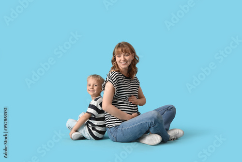 Happy pregnant mother and h...