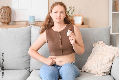 Young woman holding chocola...