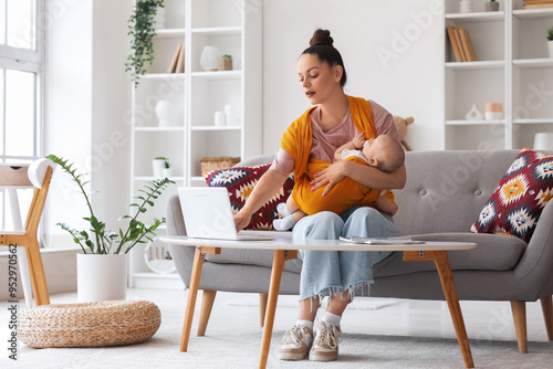 Young mother with cute litt...