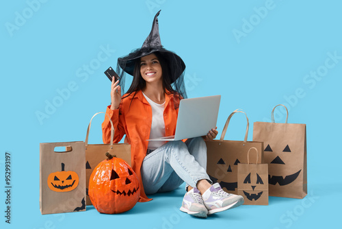 Young woman in witch hat wi...