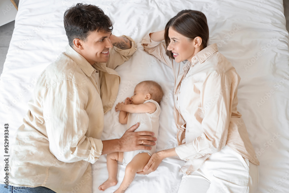Young parents with their little baby sleeping on bed, top view Young parents with their little baby sleeping on bed, top view
