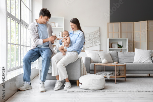 Young parents with toy and ...