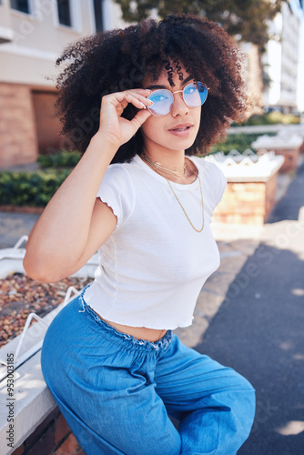 Fashion, sunglasses and portrait of girl in city for trendy, urban style or vision. African woman, cool shades and outdoor to relax with accessory for protection, confidence and reflection in summer