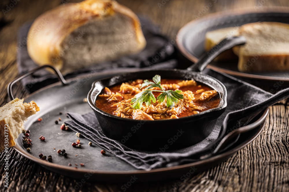 Tasty soup or stew made of beef tripe and spices. Spicy and aromatic tripe soup seasoned with pepper and served with bread