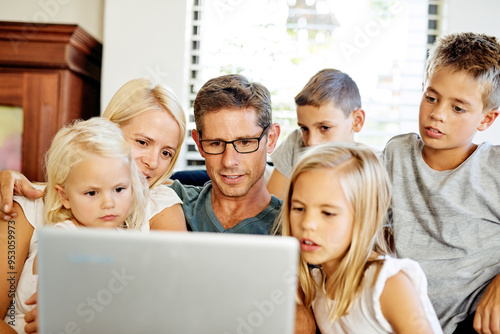 Mother, father and children in home with laptop, online education and elearning with connection. Family house, mom and dad with kids for streaming movies, video and bonding together with technology