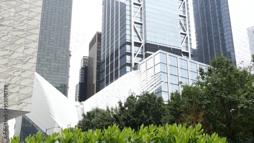 New York City Lower Manhattan Downtown Financial District street architecture, United States. One World Trade Center skyscraper building, USA. American urban park. 911 Memorial Pools by Freedom tower.