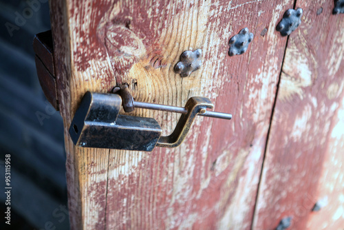 old wooden door with the metal lock in the medieval castle
