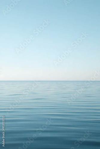 Wallpaper Mural A serene view of calm water with gentle ripples, reflecting a soft blue hue. The surface appears smooth and tranquil, creating a peaceful atmosphere. Torontodigital.ca
