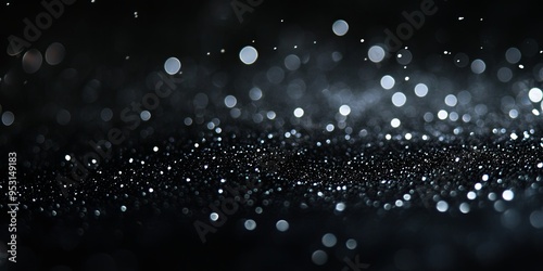 Diamond Dust on Black Velvet: A captivating abstract of shimmering silver particles scattered across a luxurious black background, reminiscent of a starry night sky. light overlay.. photo