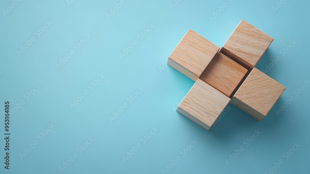 Wooden blocks forming a 3D puzzle on a blue background, problem-solving concept
