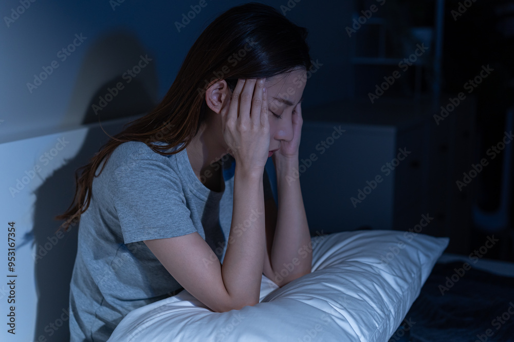 Depressed anxiety asian young woman, girl frustrated closed eyes, touching face, suffering stressed, sick, tired, crisis sitting on bed from headache, migraine pain tension problem health care concept Depressed anxiety asian young woman, girl frustrated closed eyes, touching face, suffering stressed, sick, tired, crisis sitting on bed from headache, migraine pain tension problem health care concept