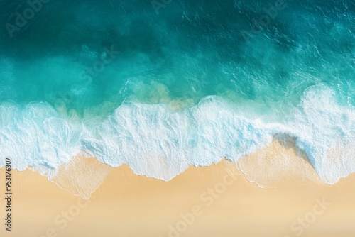 Surfing ocean waves on the beach as a background for summer vacation holidays. A aerial view looking down on the sea and beach from above.