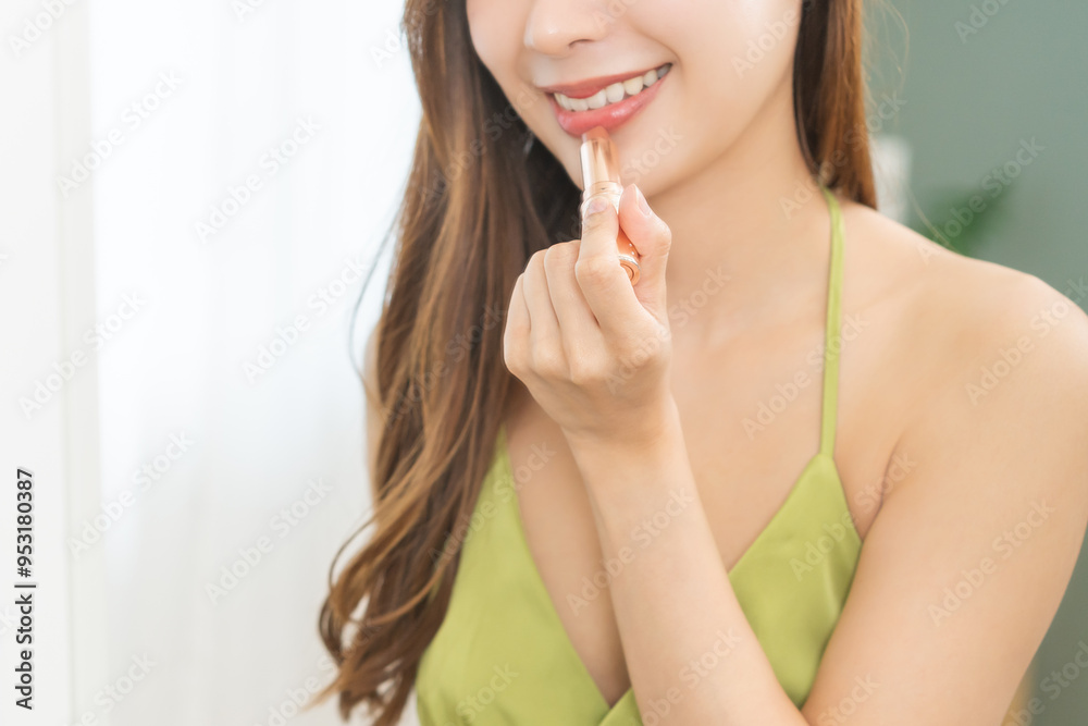 Get dress, elegant asian young woman with makeup applying red lips glamour, getting ready wearing green cloth, gorgeous female looking into mirror at home, prepare going event night party, celebration Get dress, elegant asian young woman with makeup applying red lips glamour, getting ready wearing green cloth, gorgeous female looking into mirror at home, prepare going event night party, celebration