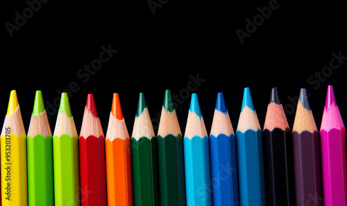 Close up of rainbow coloured pencils with copy space