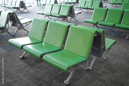 Rows of green seats for passengers look empty at the Ahmad Yani International Airport. Semarang, Indonesia. photo